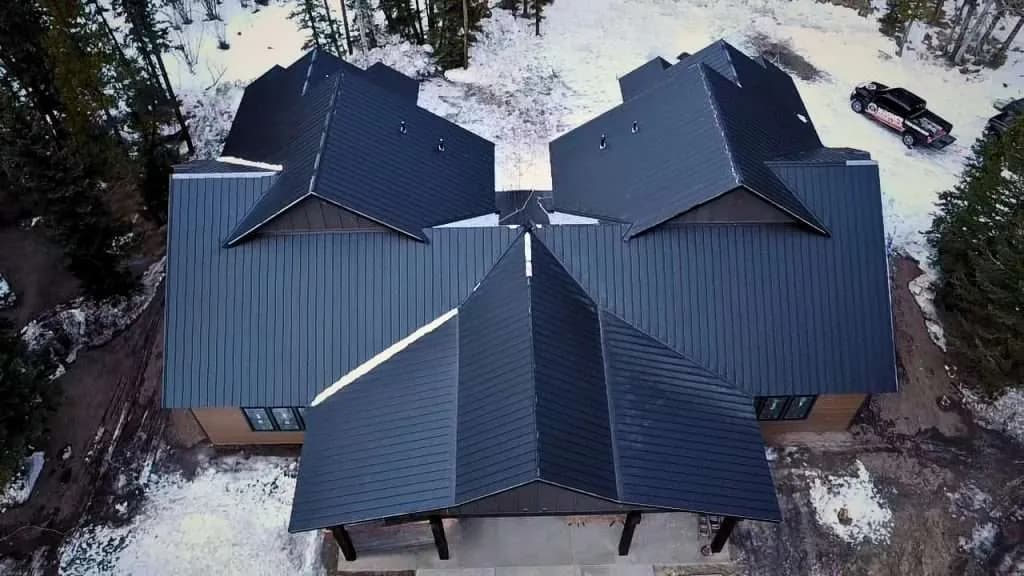 Aerial view of a completed metal roof in winter
