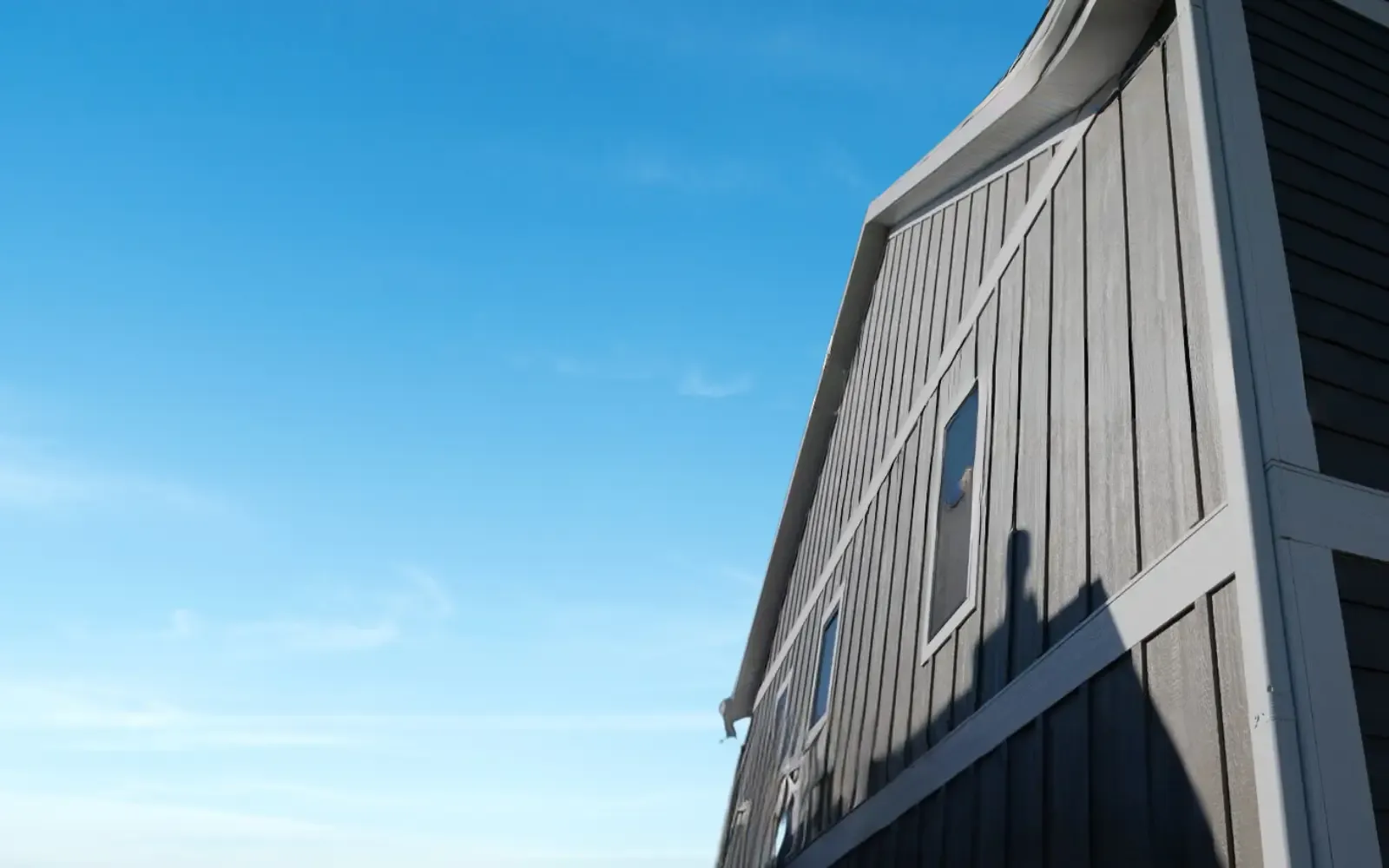 Dark board-and-batten siding on a gable wall