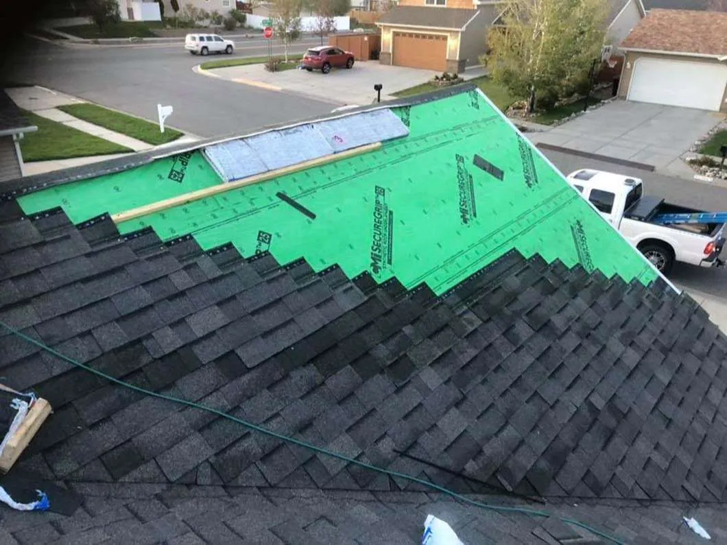 New underlayment going down as damaged shingles are replaced